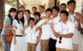 Marisol (left) with deaf students in the Philippines