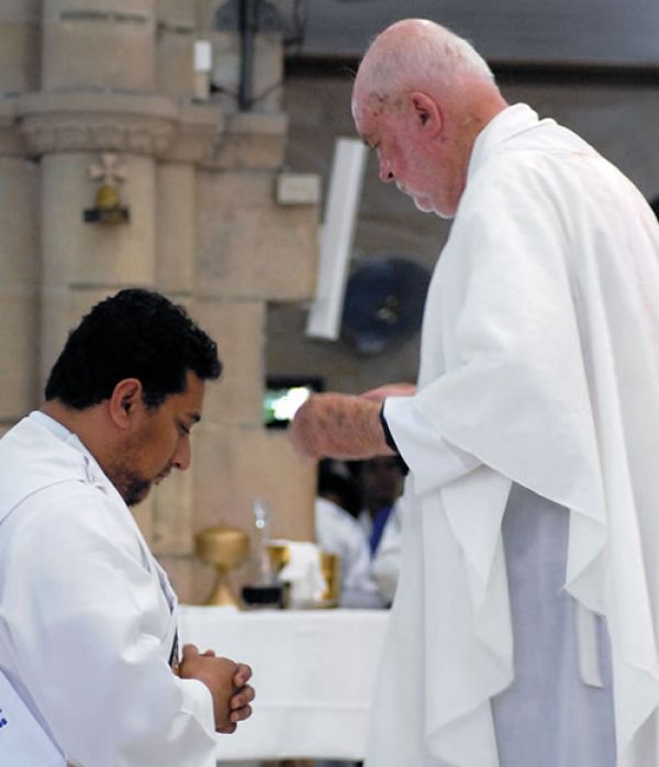 Fr. David Arms during the laying of hands