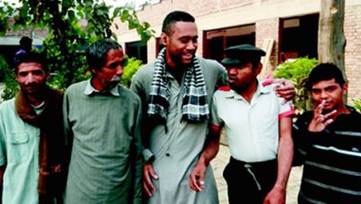 Paula (center) with friends in Pakistan